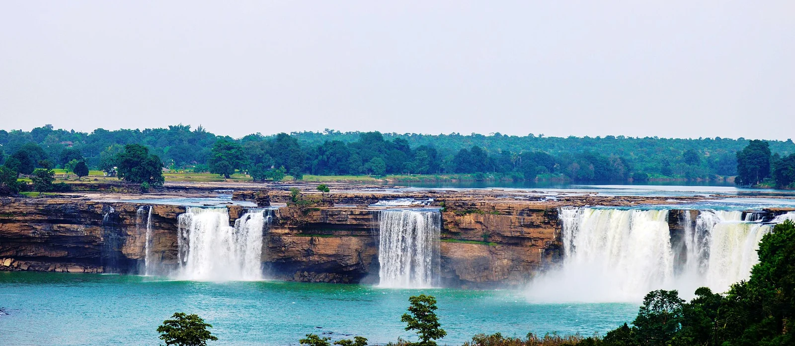 Wide panorama of the Chitrakote Falls horseshoe curtain